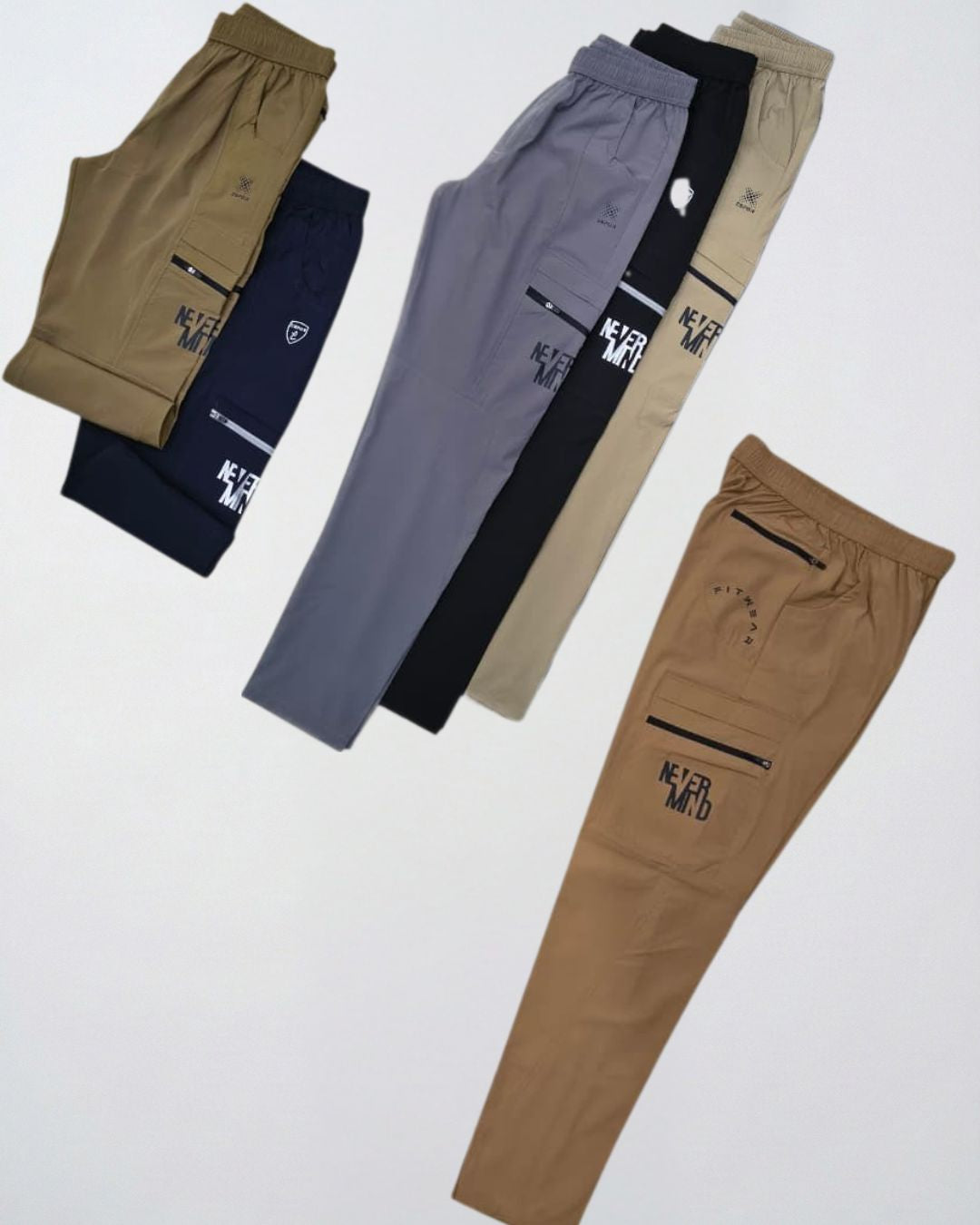 Assorted men's track pants in neutral colors with zipper pockets and 'Never Mind' text print.