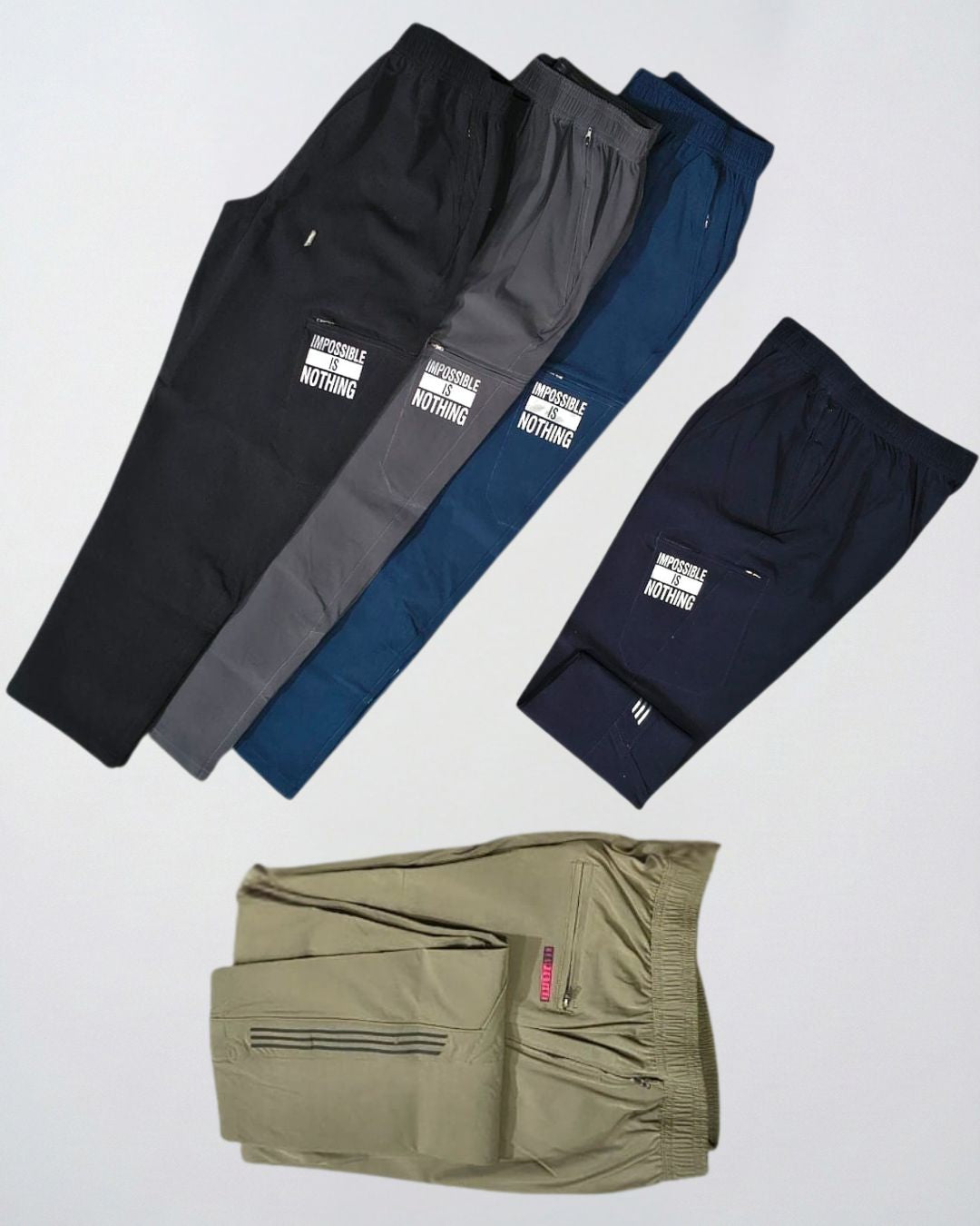 Assorted men's track pants in black, grey, navy, and olive with zip pockets and sports prints