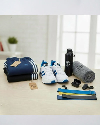 Activewear set with blue track pants, white running shoes, water bottle, towel, earbuds, and resistance bands on a table