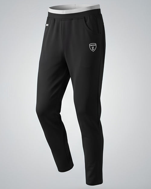 Black athletic track pants with white elastic waistband and side pockets on plain background