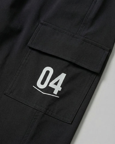 Black track pants with side cargo pocket and white number 04 print, activewear detail