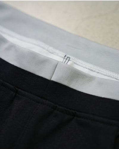 Close-up of premium track pants waistband with soft, durable fabric stitching